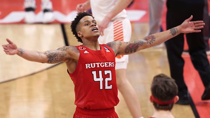 Rutgers guard Jacob Young holds out his arms during a win over Clemson